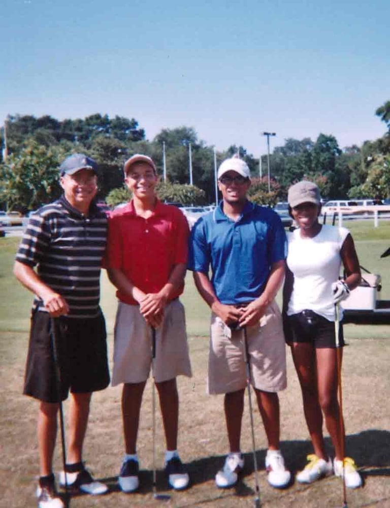 Par Four Golf Club image of four golfers posing with their golf clubs