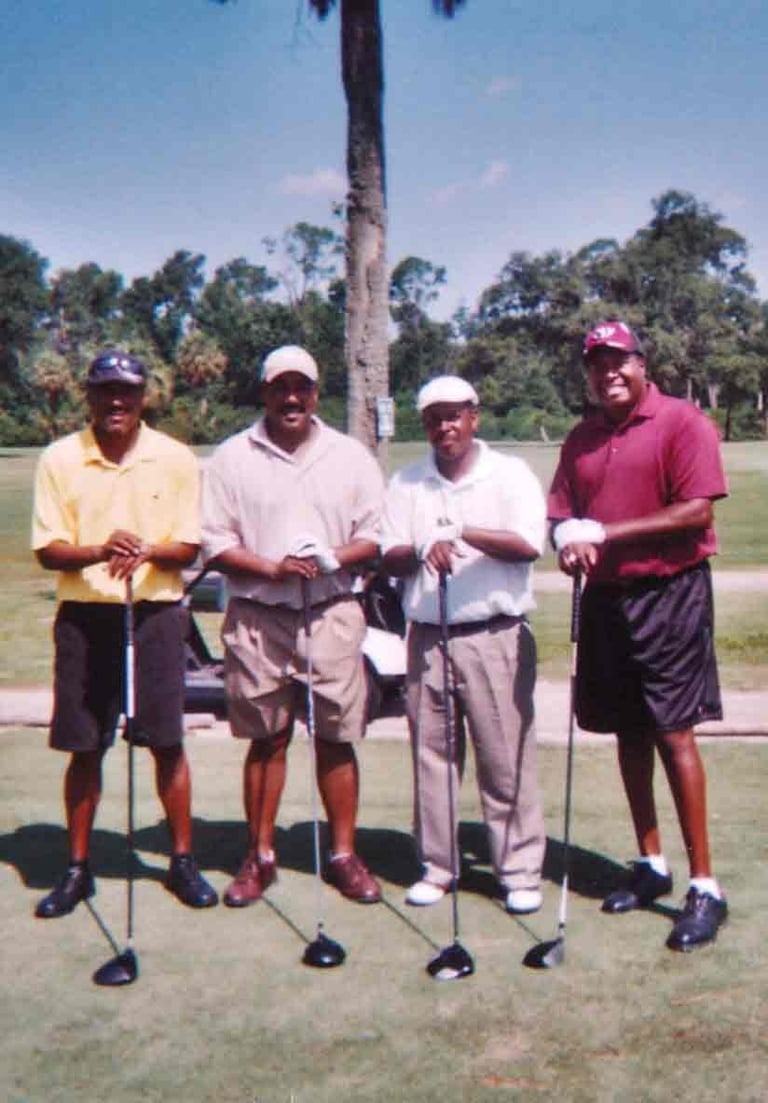 Par Four Golf Club image of four black golfers posing with their golf clubs