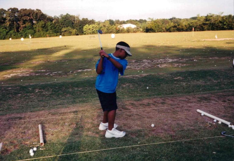 Par Four Golf Club image of young black golfer practicing