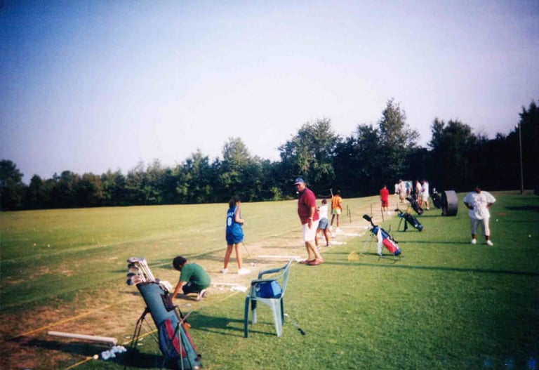 Par Four Golf Club image of young golfers practicing with coaches