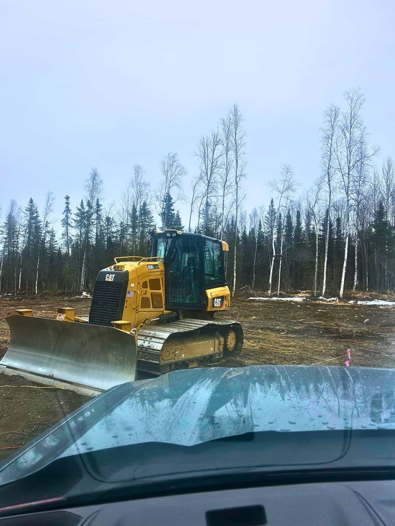 CAT DK52 LGP Bulldozer Sits On Job Site On An Overcast Day In Houston Alaska. 