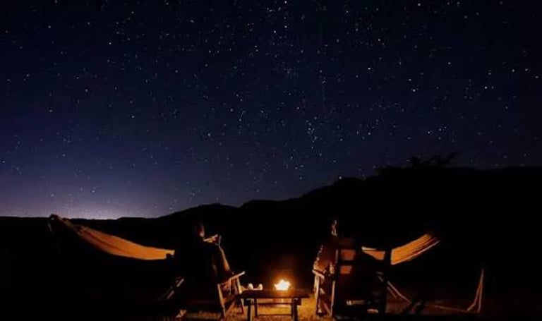 Open sky desert camping and stargazing on traditional charpai in Thar sand dunes