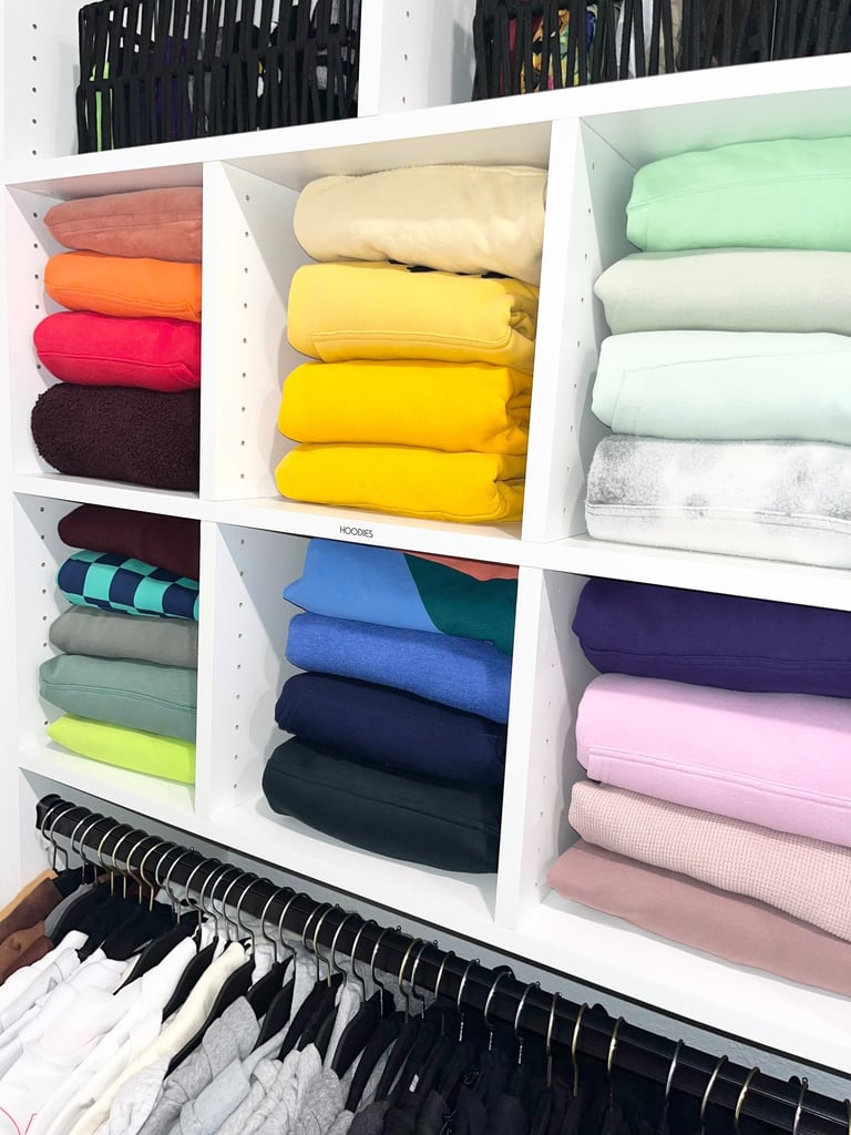 Neatly folded clothing arranged in a master closet as part of a home organizing refresh service