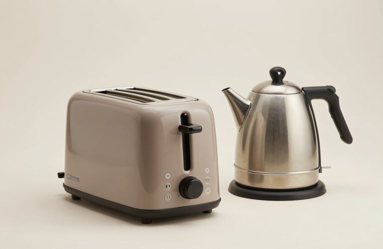 Clean studio photography of a modern toaster and kettle set in muted taupe on a soft off-white surface, representing high-quality South American / Brazilian home staples.