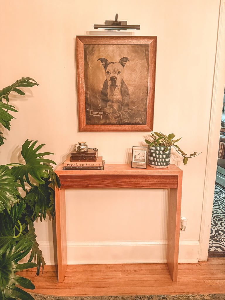 Handmade custom-sized entry table with contrasting oak and walnut wood detailing.