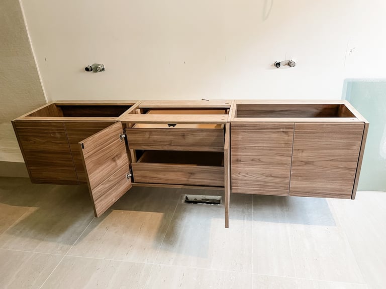 Custom-made vanity in the process of being installed at a client's home.