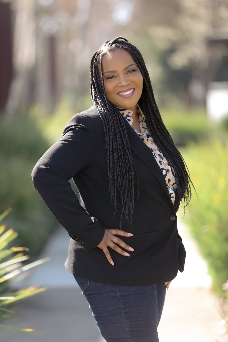 African American women with long braids smiling
