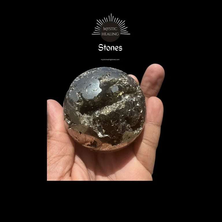 Polished pyrite sphere crystal held in hand showing a natural metallic cluster geode center.