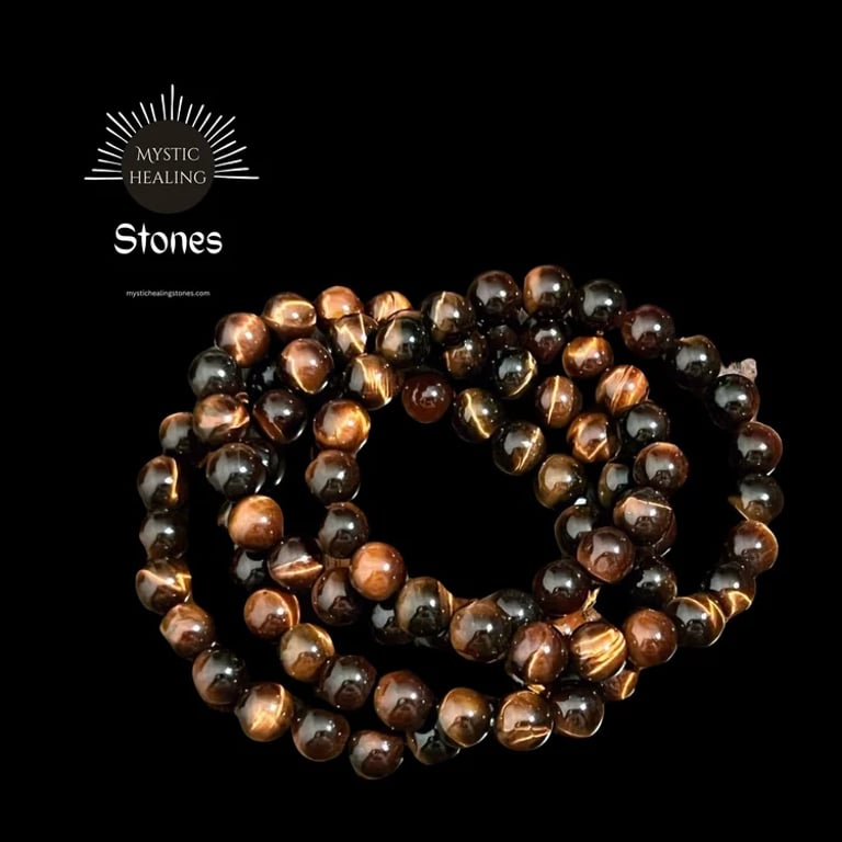Polished red tiger eye crystal beaded bracelets for healing and protection on a black background.