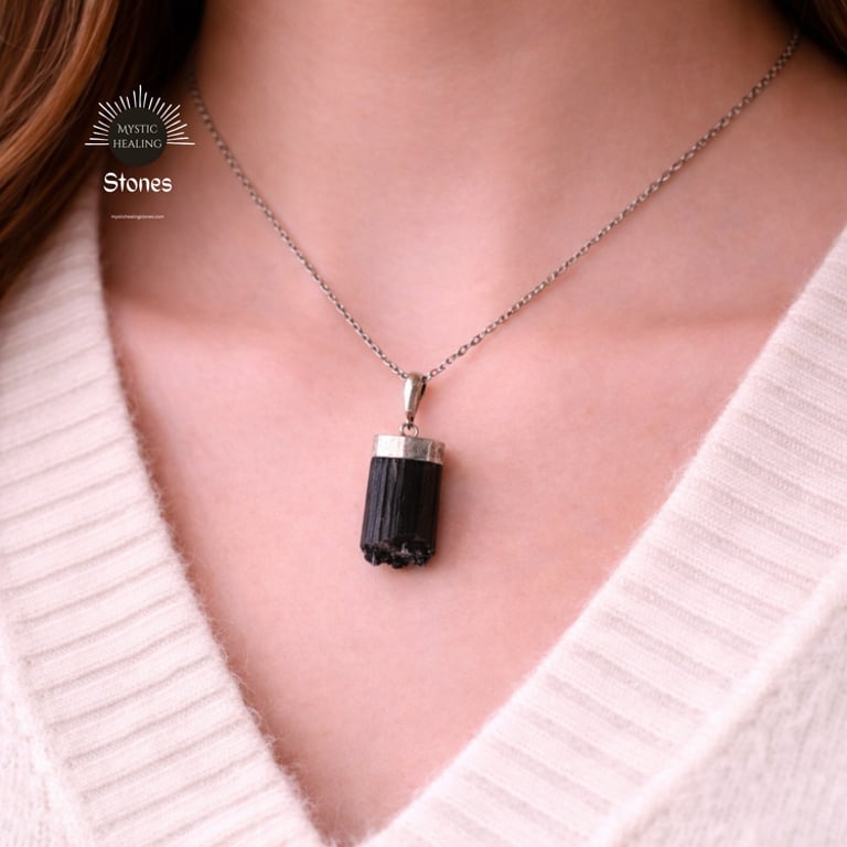 A woman wearing a raw black tourmaline crystal pendant necklace for protection and grounding.