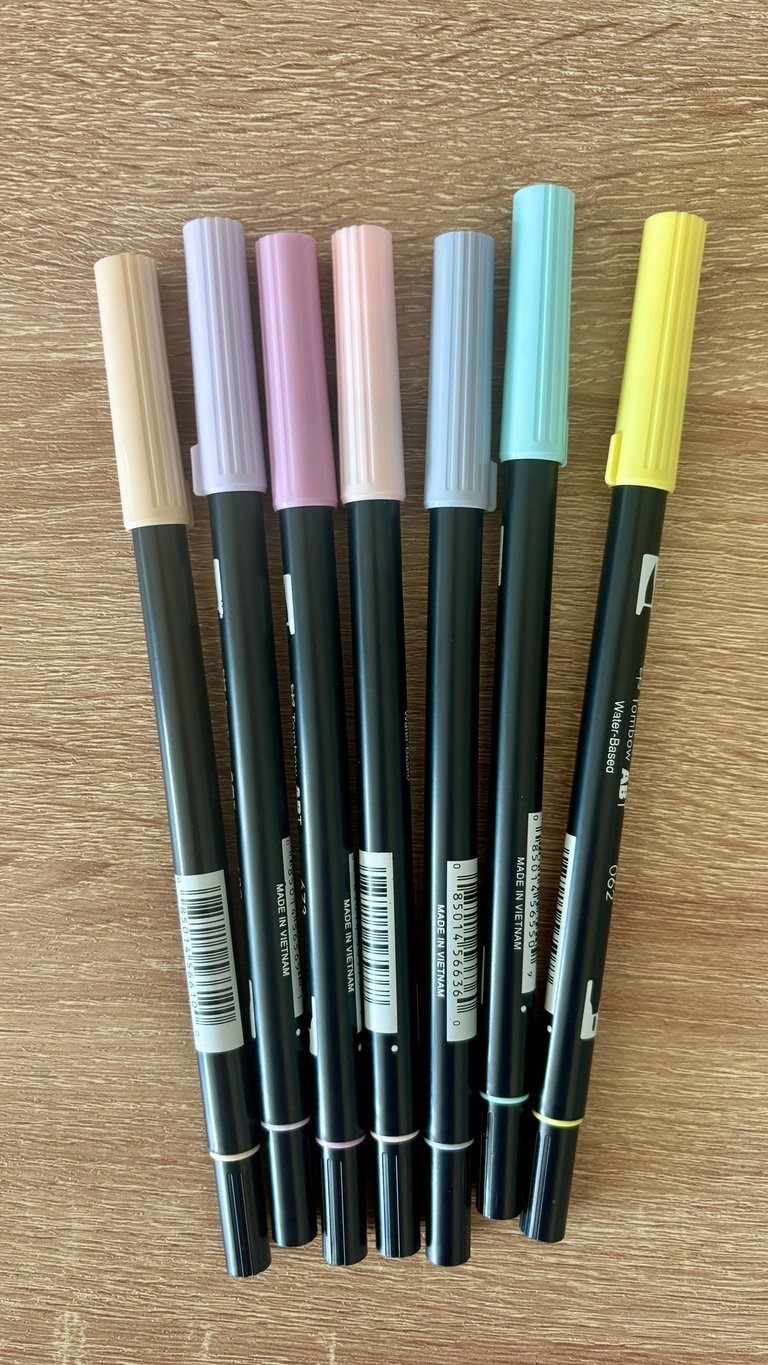 Tombow Dual Brush Pens in various shades for creative journaling and artful layouts.