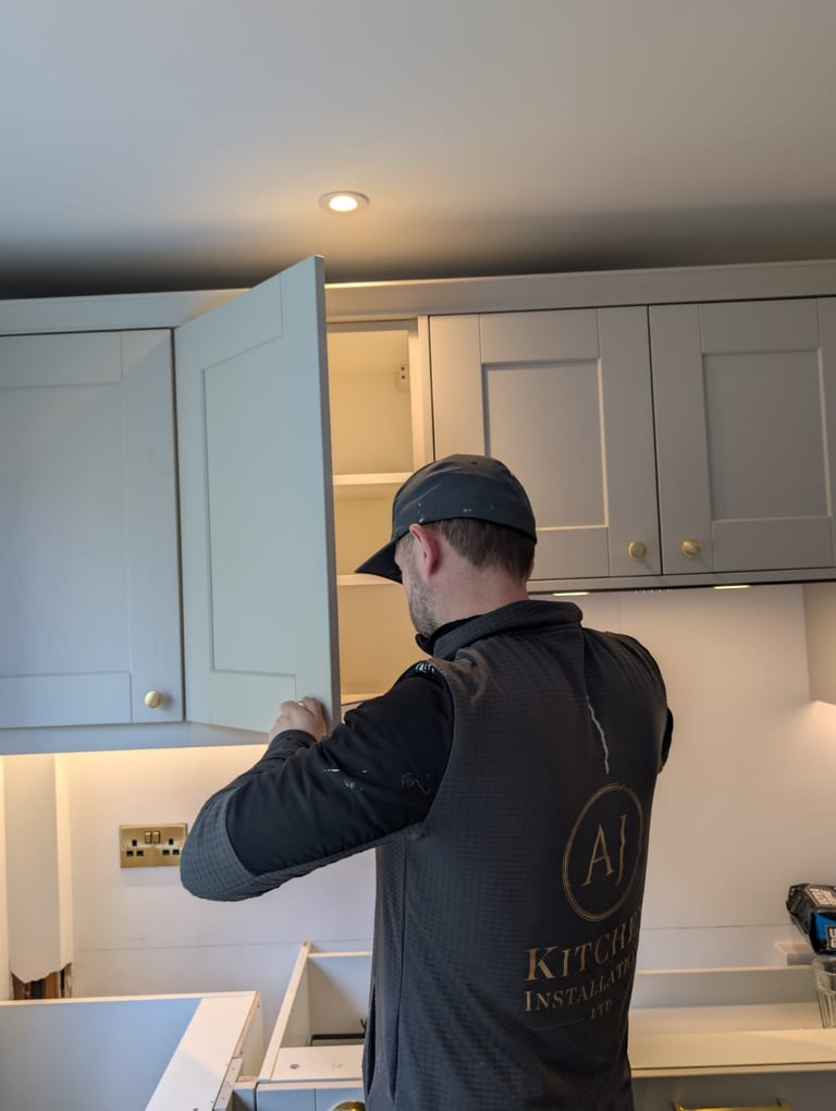 Anthony Installing kitchen cabnet 
