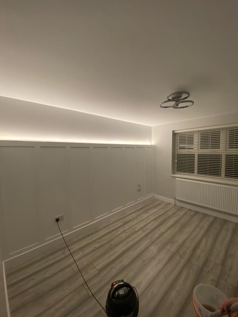 Bedroom renovation with panelled feature wall and LED lighting