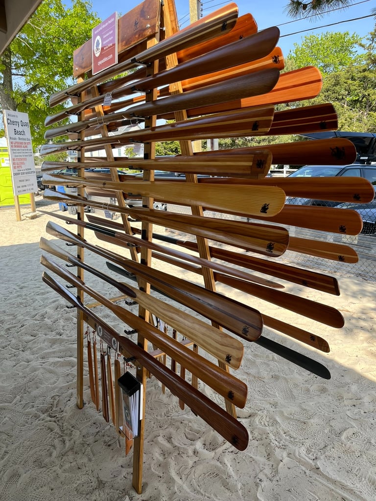 many greenland paddles on display