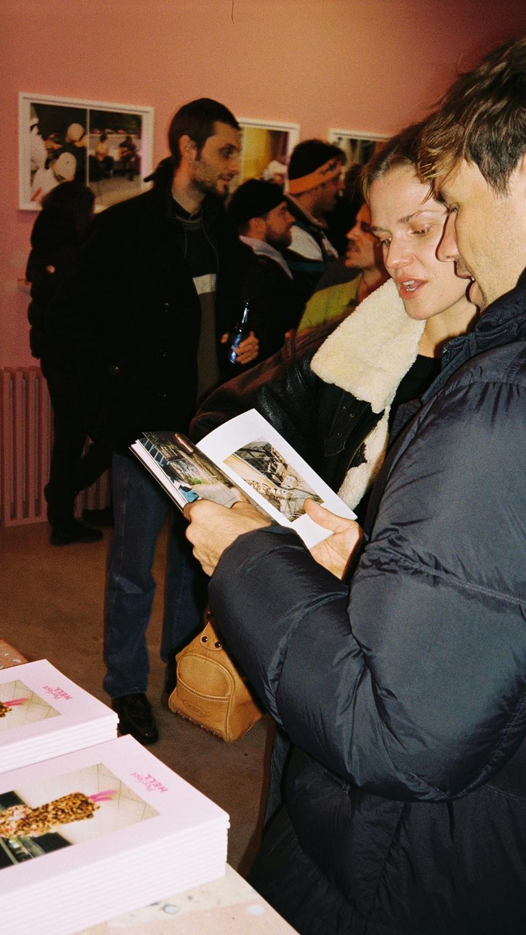 Attendees flipping through the Perfect HELL™ zines