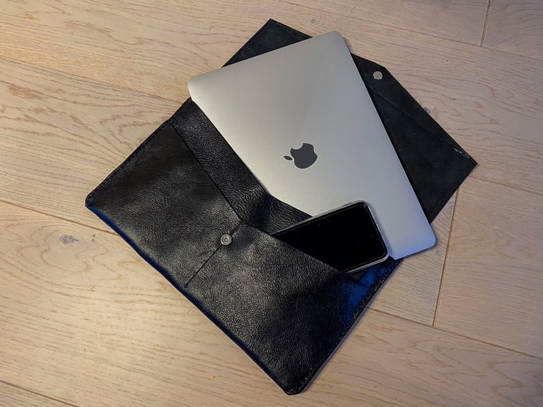 Laptop in leather pouch