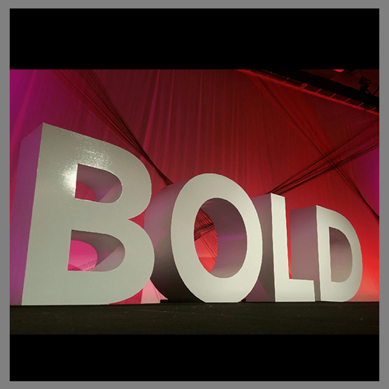 "BOLD" stage lettering for set. Event designed and produced by Comprehensive Creations team.