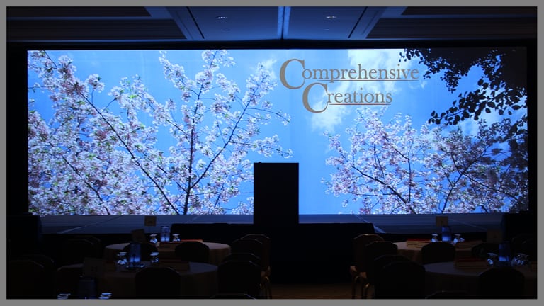 "Cherry Blossom" set with CC logo on screen. Event designed and produced by Comprehensive Creations team.