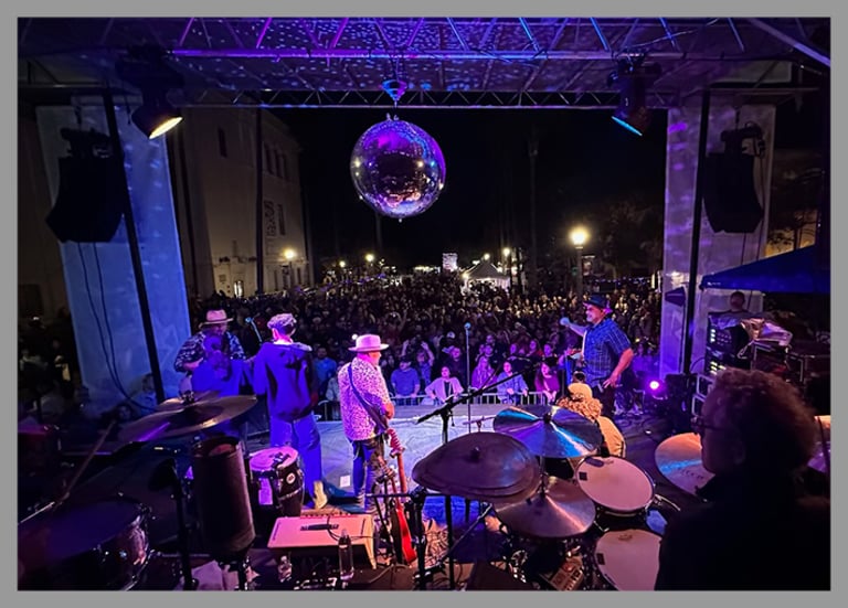 Backstage shot of December Nights event in San Diego while band is playing.