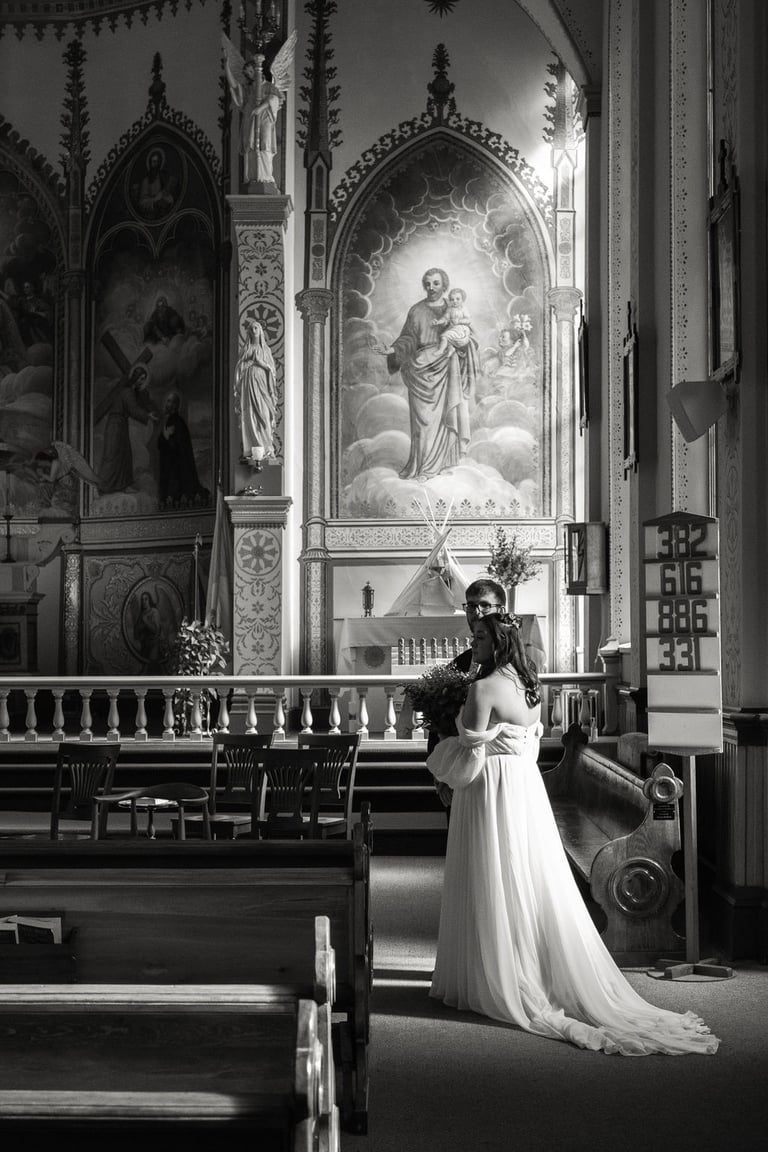 bride and groom, black and white photo, St. Ignatius Mission church, sunlight