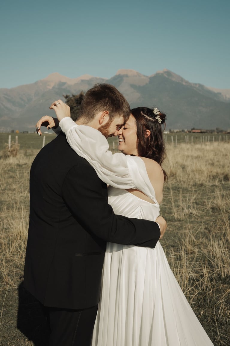 bride and groom portrait, Montana mountains, field