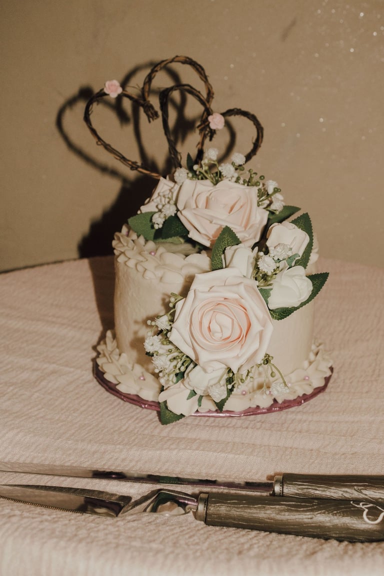 wedding cake detail shot, pink flowers, hearts