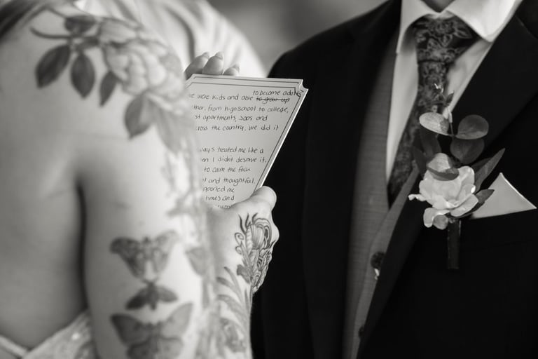 black and white closeup of vows during ceremony