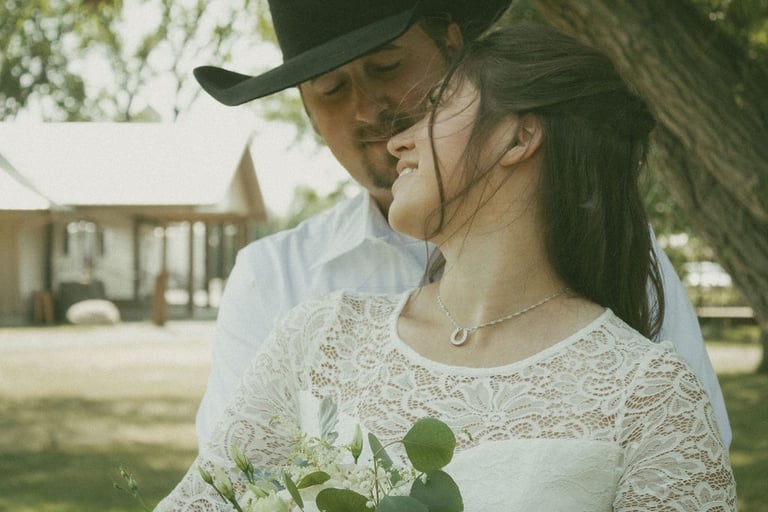 bride and groom portrait, horseshoe necklace, lace dress