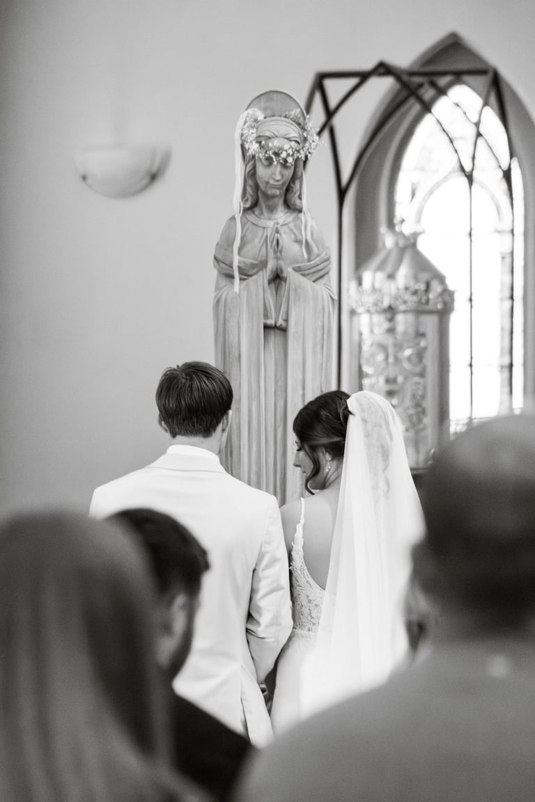 black and white photo, flowers for Mary, Catholic wedding ceremony