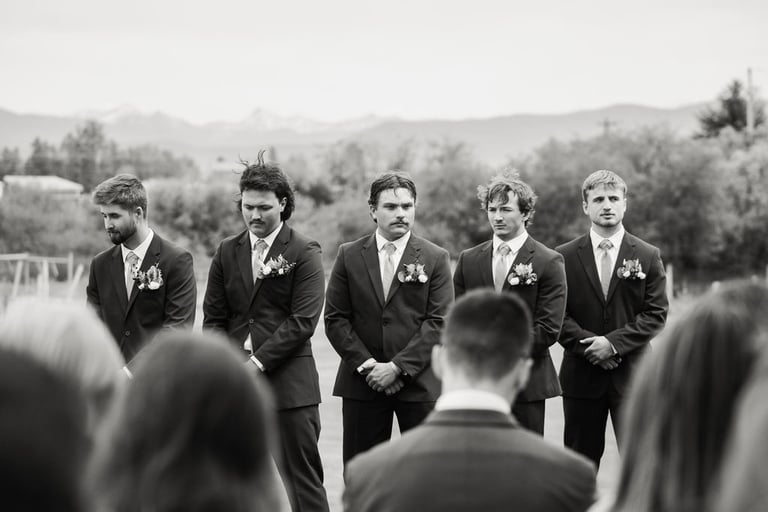 black and white shot of groomsmen during ceremony, Kalispell wedding
