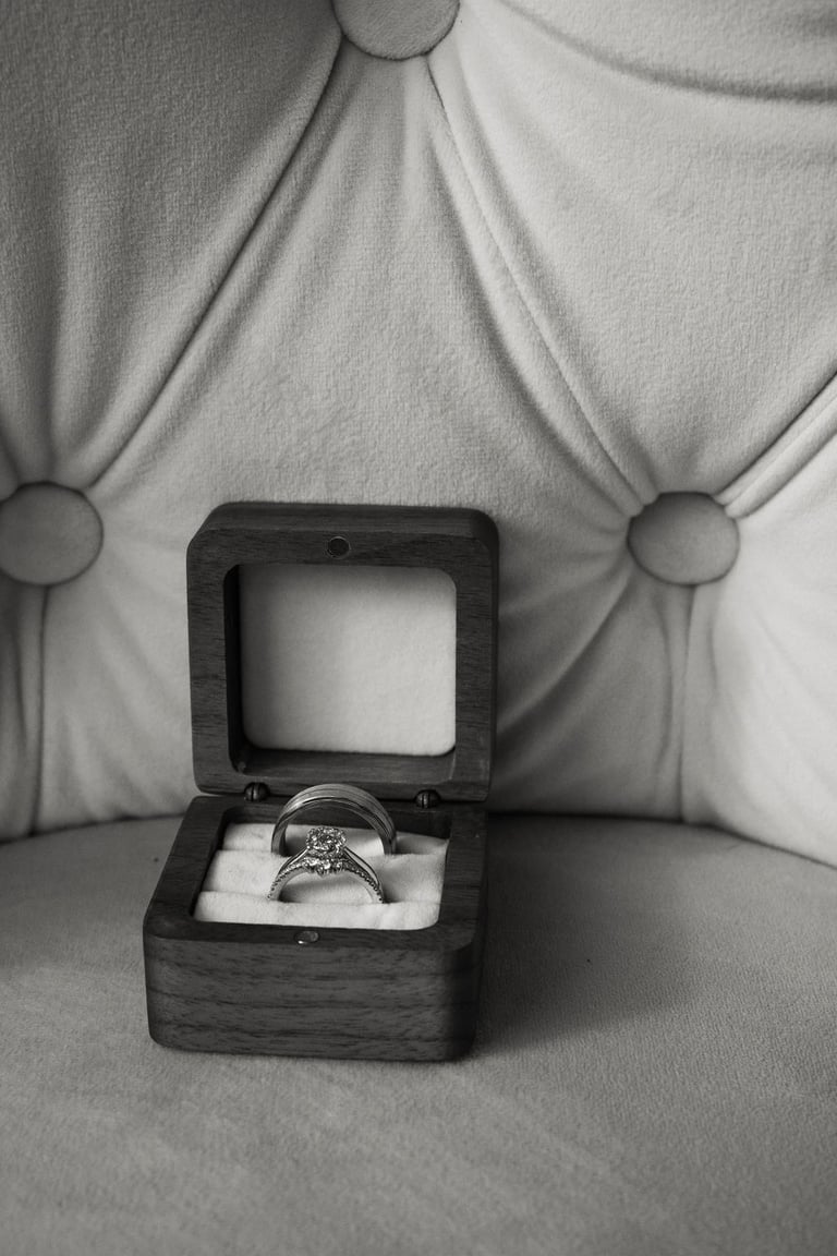 detail shot of wedding bands in a wooden box