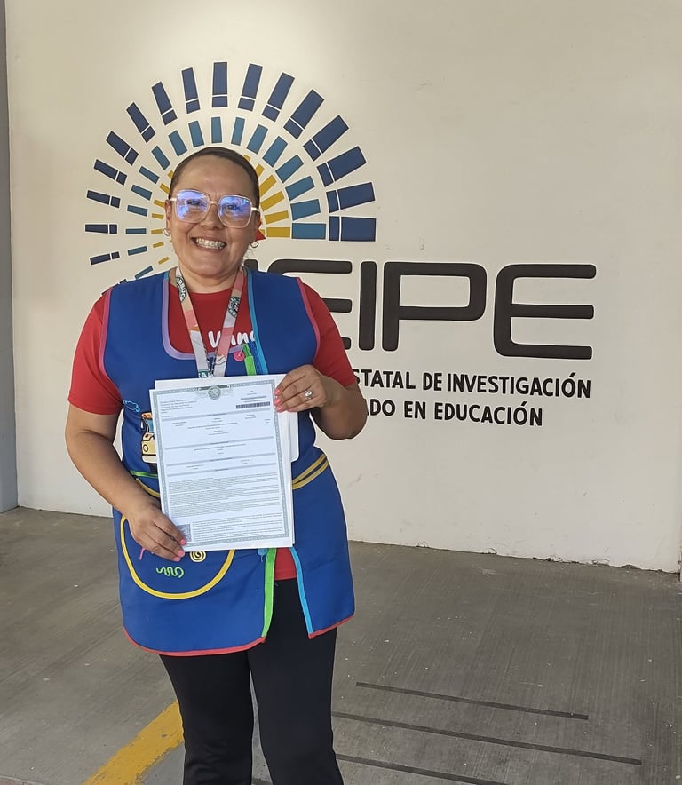 Smiling educator holding an official certificate in front of the CEIPE education research logo.