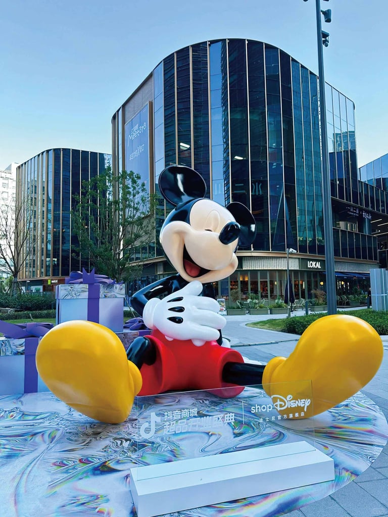 Large Mickey Mouse fiberglass sculpture for Disney 100 Exhibition, outdoor promotional installation in Shanghai by DEFARA.