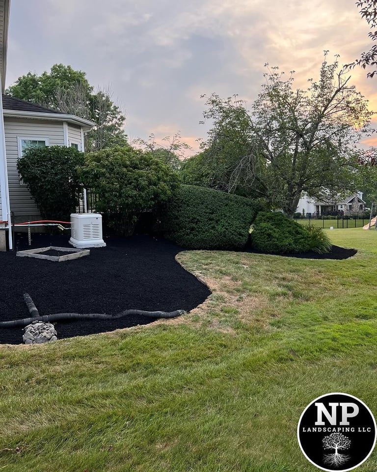 excellent landscaping and hardscaping of grass, stones and trees by NP Landscaping