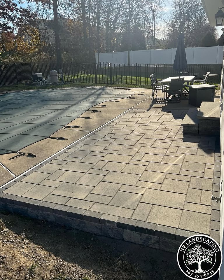 excellent landscaping and hardscaping of grass, stones and trees by NP Landscaping