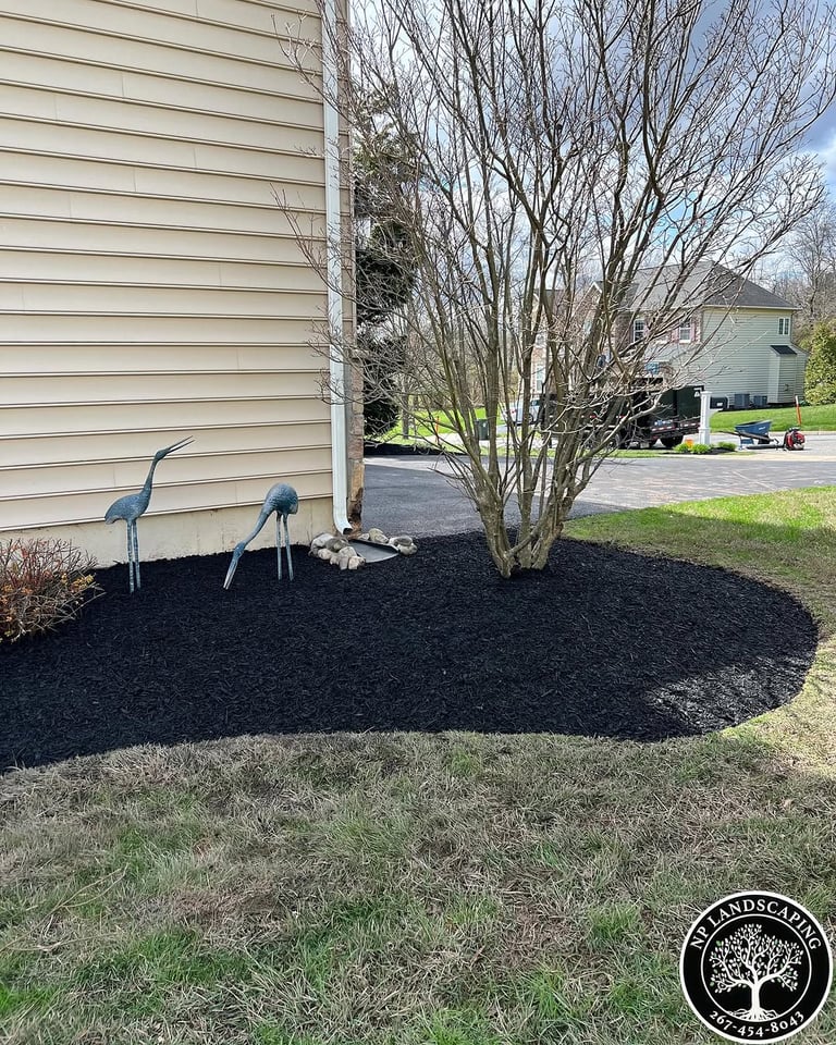 excellent landscaping and hardscaping of grass, stones and trees by NP Landscaping