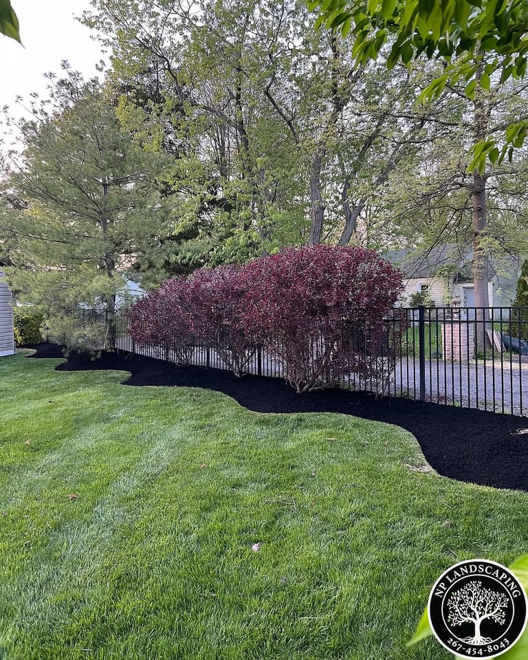excellent landscaping and hardscaping of grass, stones and trees by NP Landscaping