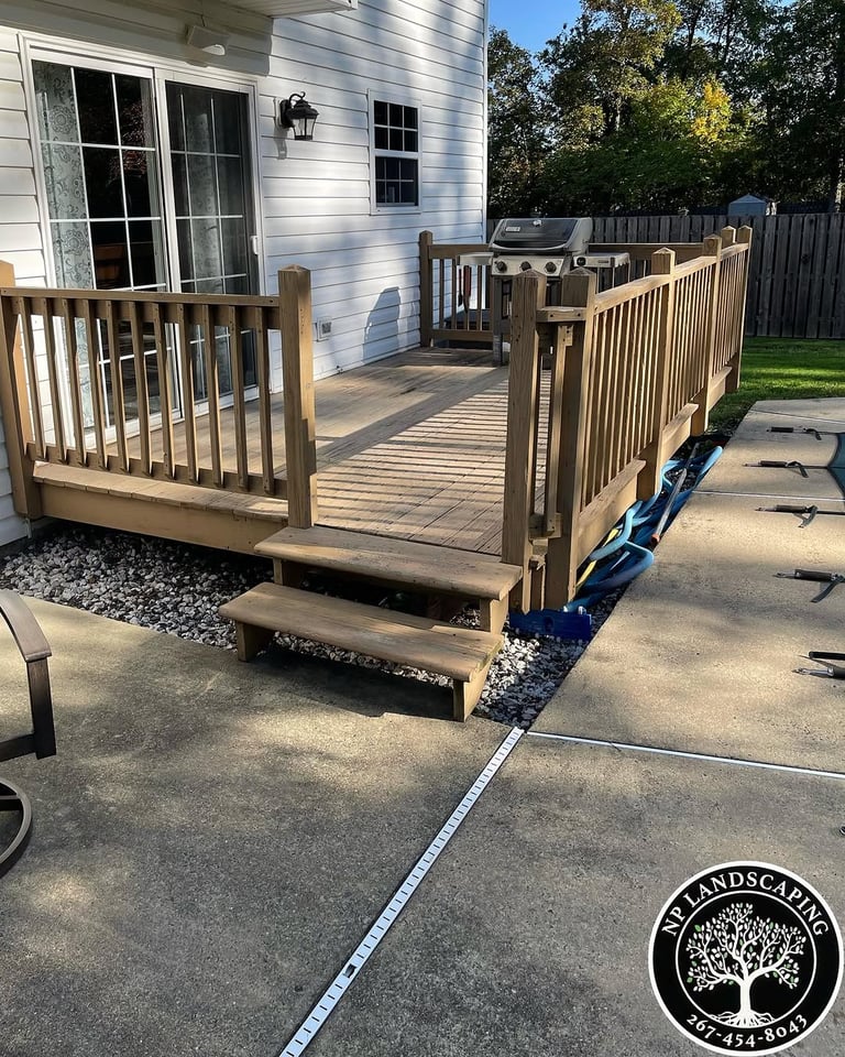 excellent landscaping and hardscaping of grass, stones and trees by NP Landscaping