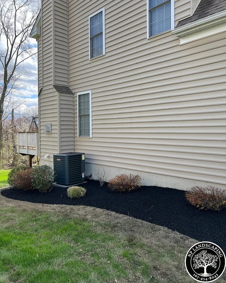 excellent landscaping and hardscaping of grass, stones and trees by NP Landscaping