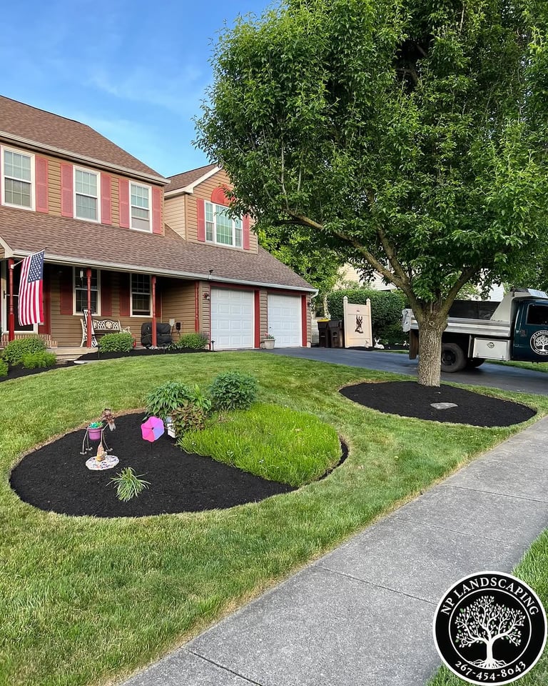 excellent landscaping and hardscaping of grass, stones and trees by NP Landscaping