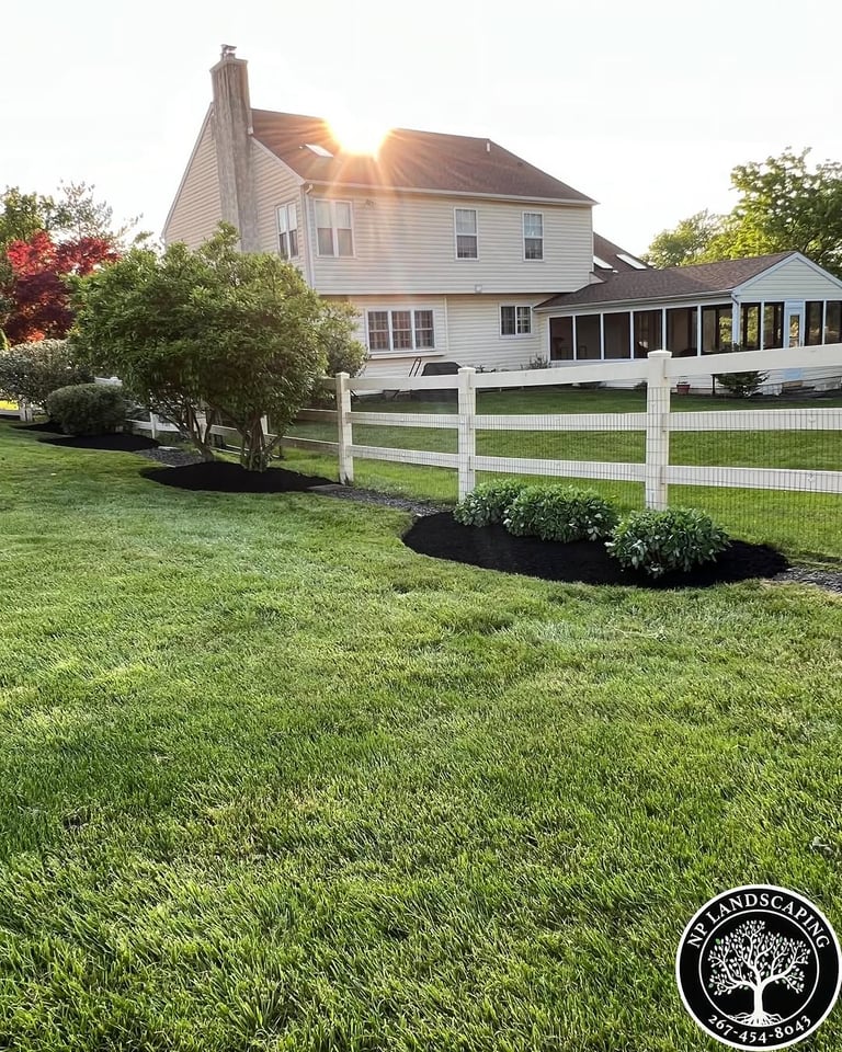 excellent landscaping and hardscaping of grass, stones and trees by NP Landscaping
