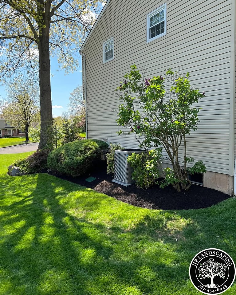 excellent landscaping and hardscaping of grass, stones and trees by NP Landscaping