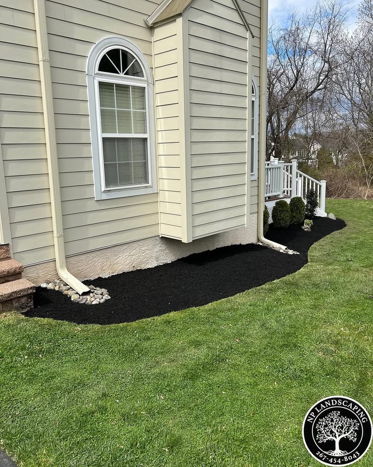 excellent landscaping and hardscaping of grass, stones and trees by NP Landscaping