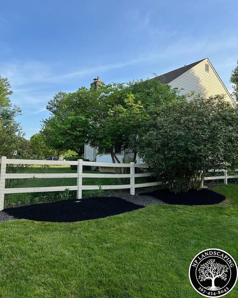 excellent landscaping and hardscaping of grass, stones and trees by NP Landscaping