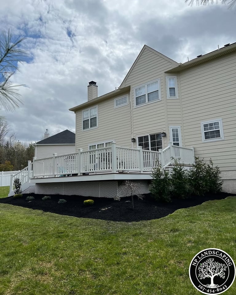 excellent landscaping and hardscaping of grass, stones and trees by NP Landscaping