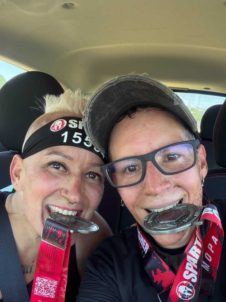 Biting Spartan Sprint medals after Texas race