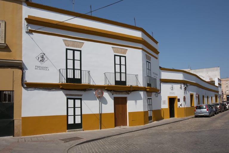 Exterior view of Pettersen Brandy's bodega in Jerez de la Frontera, spotlighting the main entrance in the image.