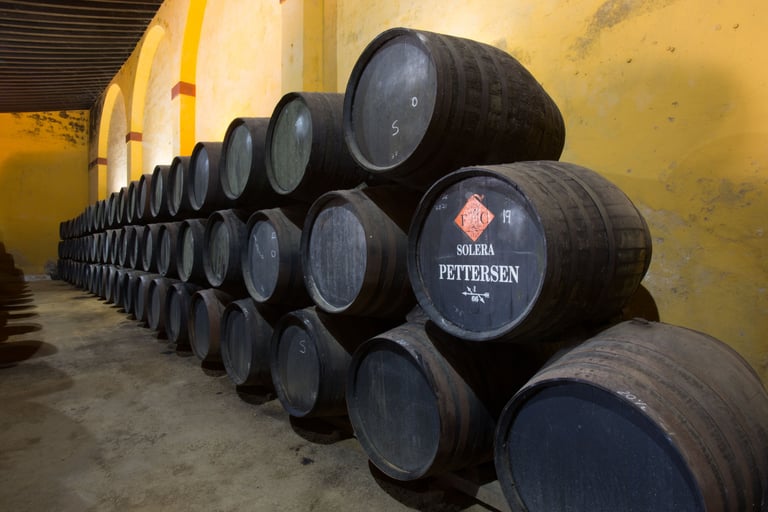 Interior view of Pettersen Bodega, showcasing wine casks used for the storage of their signature Brandies.