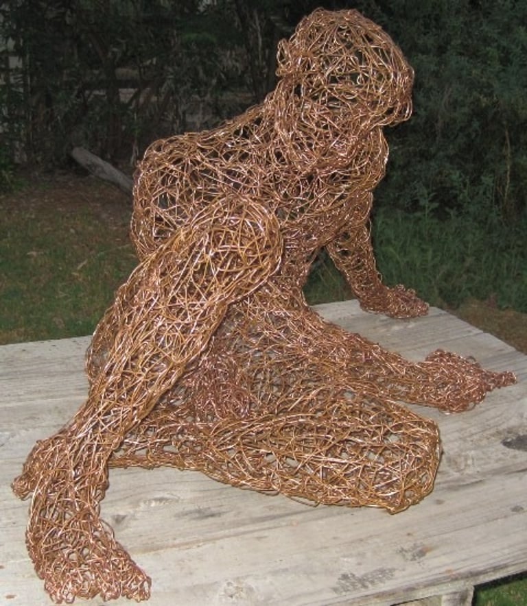 Copper wire sculpture of a young boy 