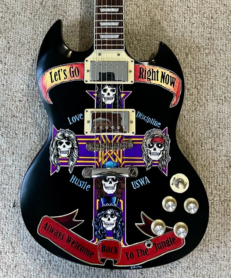 Hand painted guitar by Nancy Elhallak 